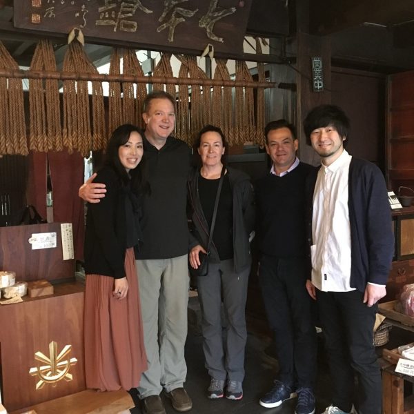 Bob and Susan DeRoose, center with Chihiro Shimizu, left, and Yasunobu Tomita of the Tomita Brewery on right