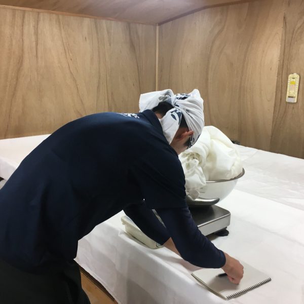 Measuring koji in the muro at Izumo Fuji